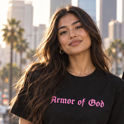 Front lifestyle view of the Armor of God Classic T-Shirt in Pink