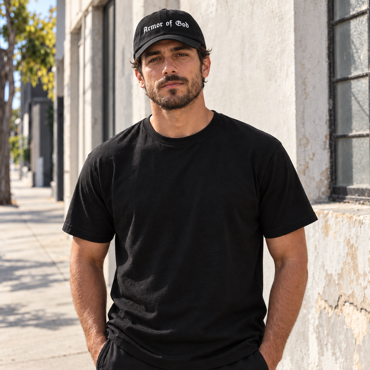 Front lifestyle view of a model wearing the Armor of God Dad Hat in black