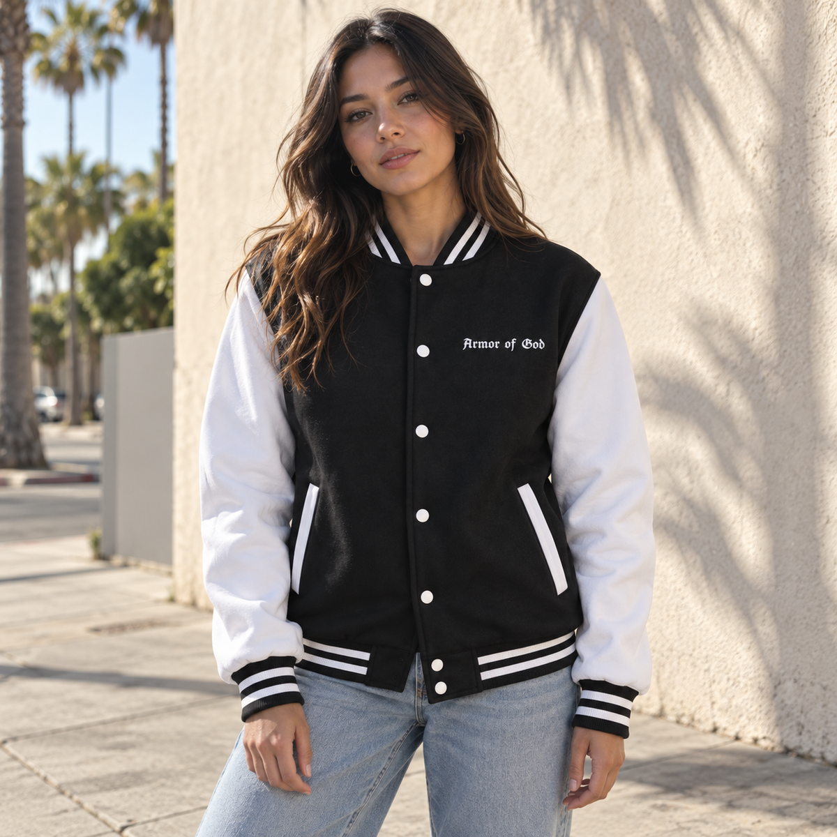 Armor of God Letterman Jacket, female model wearing the front in Los Angeles