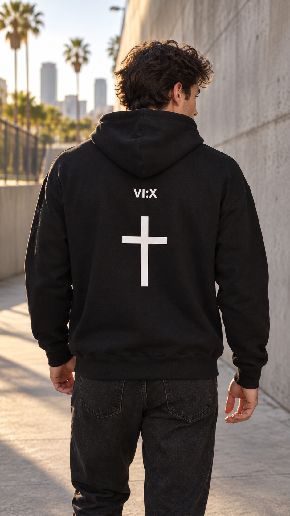 Armor of God Pullover Hoodie, male model wearing the back with VI X cross graphic in Los Angeles
