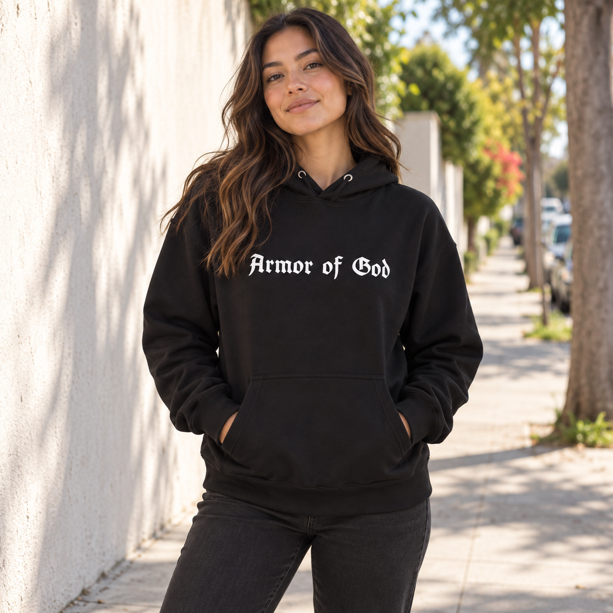 Armor of God Pullover Hoodie, female model wearing the front in Los Angeles