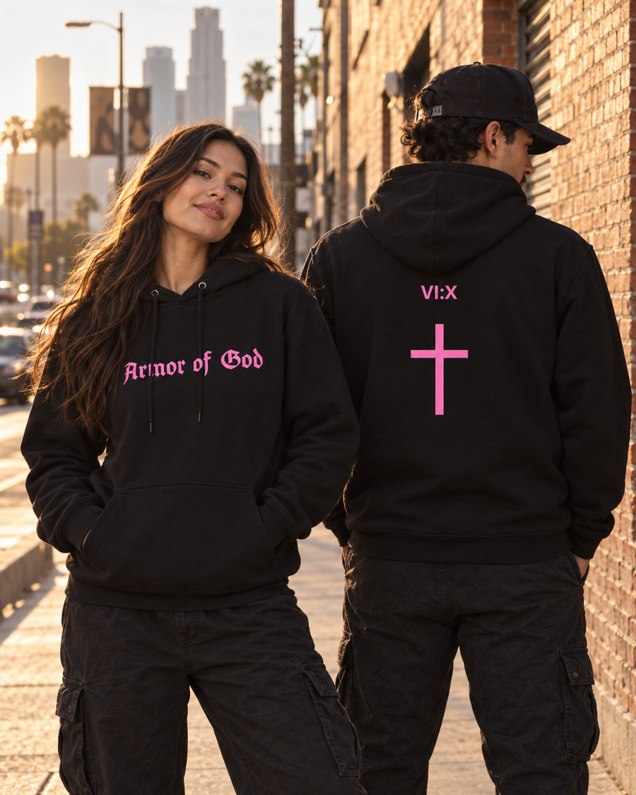 Two models showing the front and back of the pink Armor of God Pullover Hoodie in Los Angeles