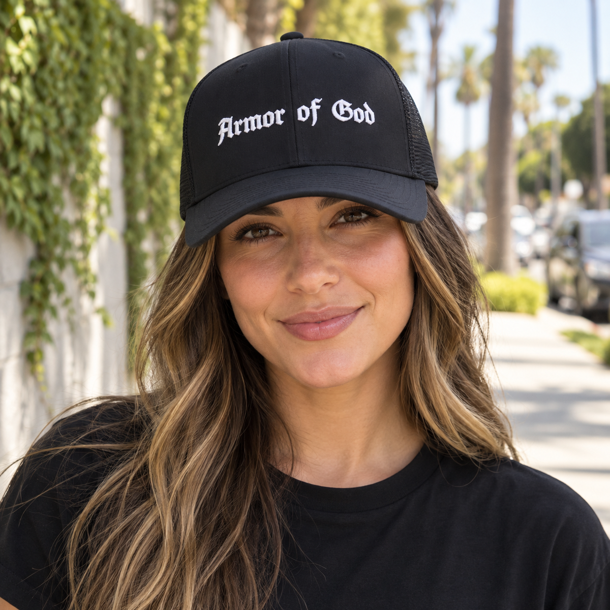 Armor of God Trucker Cap, female model wearing the embroidered front in Los Angeles