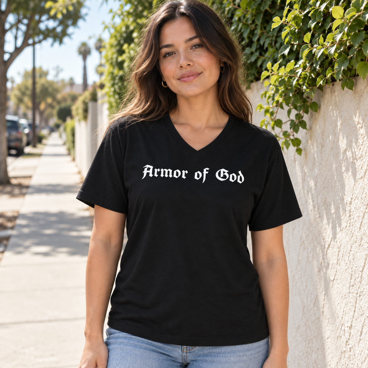 Female model wearing the Armor of God V-Neck T-Shirt in black, front lifestyle view